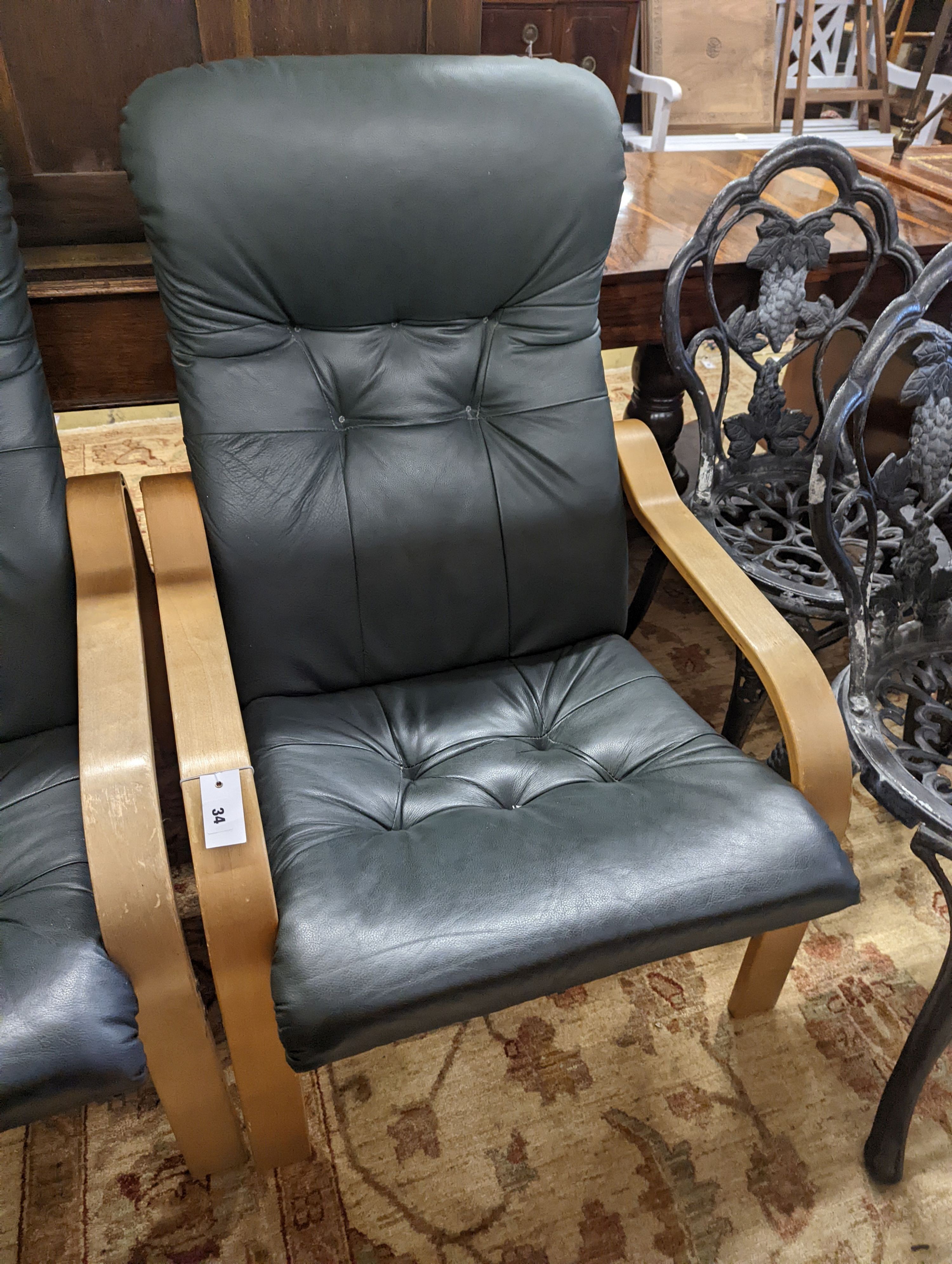 A pair of mid century Norwegian green leather and bent ply armchairs, width 68cm, depth 80cm, height 96cm